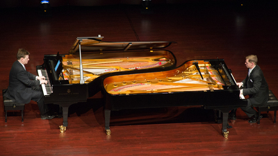 Mark Jenkins (left) and Ryan Malone perform in Armstrong Auditorium on February 16. (Photo: Matt Friesen) as apart of the Armstrong International Cultural Foundation concert series.