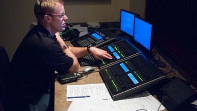 Armstrong Auditorium lighting engineer David Weeks preps for a Brian Stokes Mitchell concert on March 11. (Photo: Matthew Friesen)