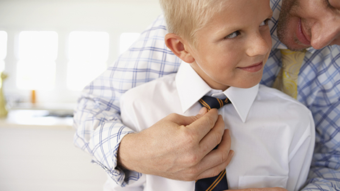 Father Helping His Son with Tie