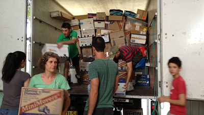 Australian PCG volunteers unload a moving truck at the new regional office facility in Wollongong. (Photo: Elizabeth Macdonald)