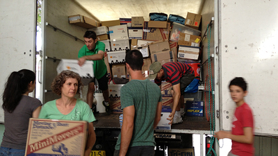 Australian PCG volunteers unload a moving truck at the new regional office facility in Wollongong. (Photo: Elizabeth Macdonald)