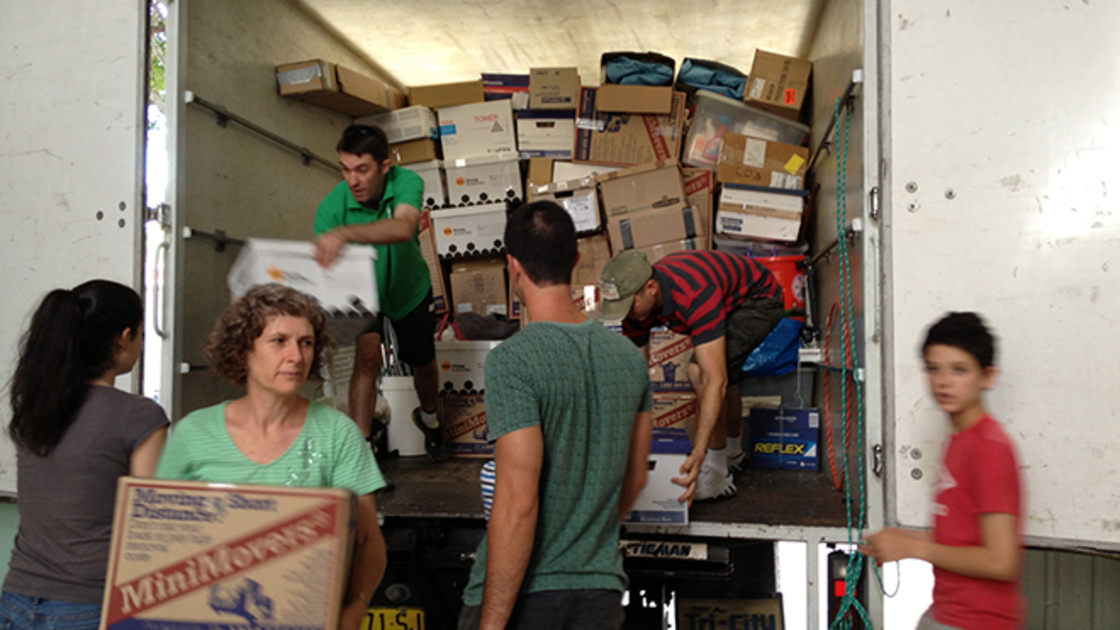 Australian PCG volunteers unload a moving truck at the new regional office facility in Wollongong. (Photo: Elizabeth Macdonald)