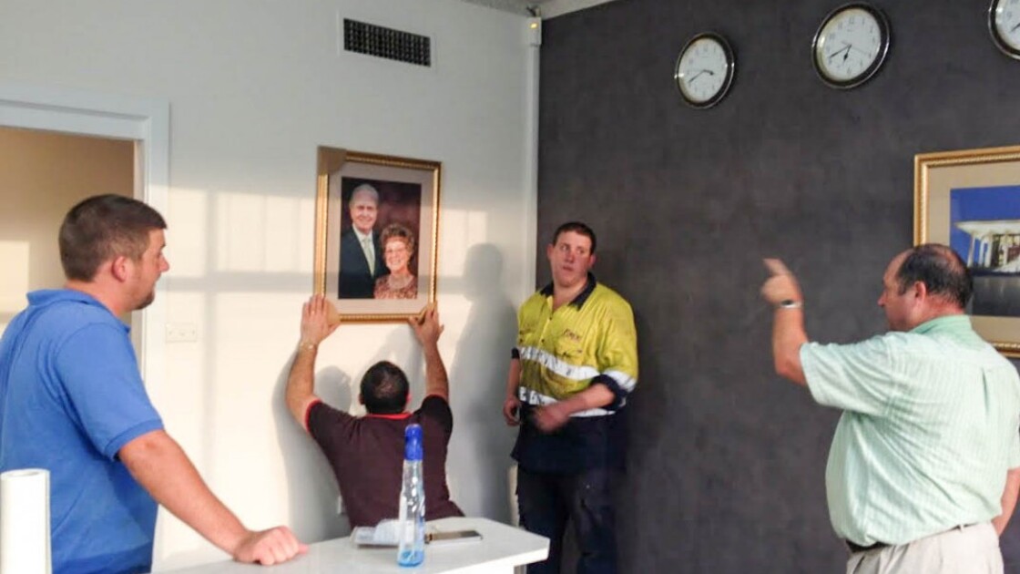 Australian volunteers assist Regional Director John Macdonald (right) with setting up the reception area. (Photo: Elizabeth Macdonald)