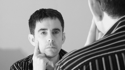 Man looking in a mirror