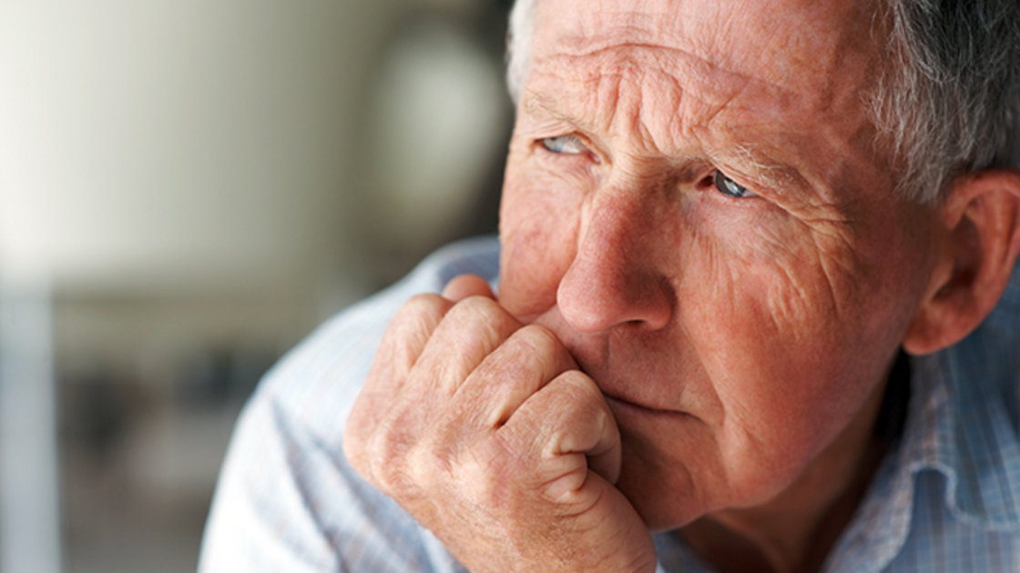 Elderly man lost in thought