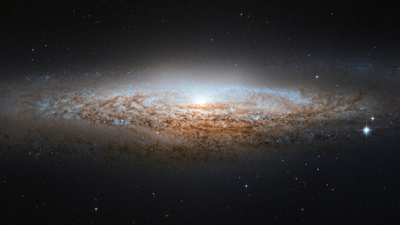 A photo of a galaxy. Who was Christ before His physical birth?