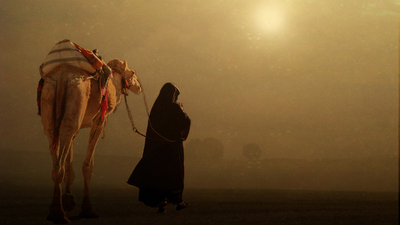 Man and camel leaving