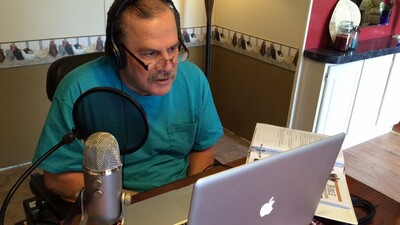 Special member services department volunteer Bob Harmon narrates the Herbert W. Armstrong College Bible Correspondence Course. (Photo: Deborah Douglas)