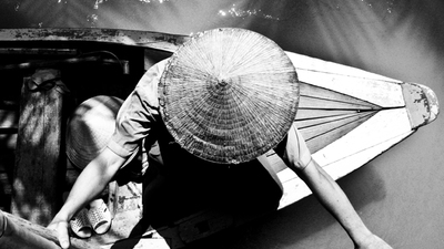 Thai man in canoe