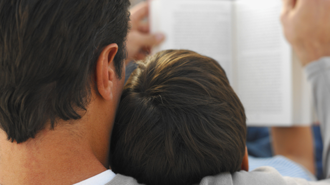 Father reading with his son 