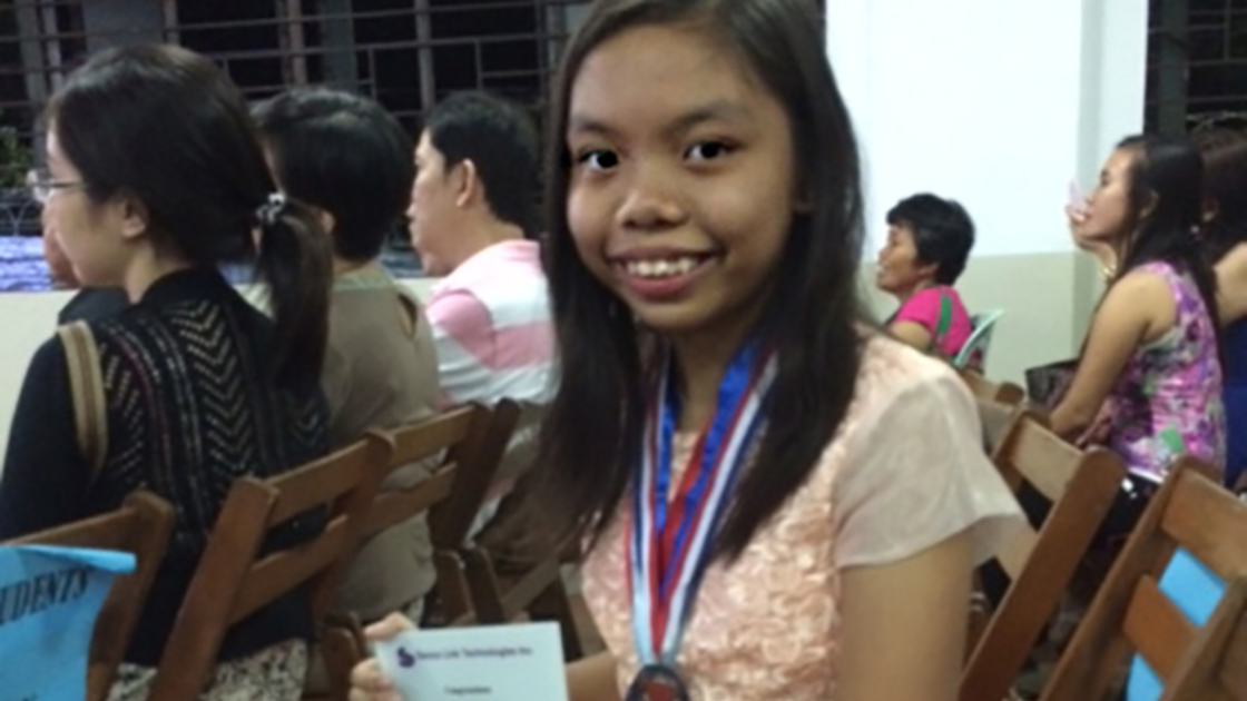 A happy smile after receiving an award for publishing her iBook.