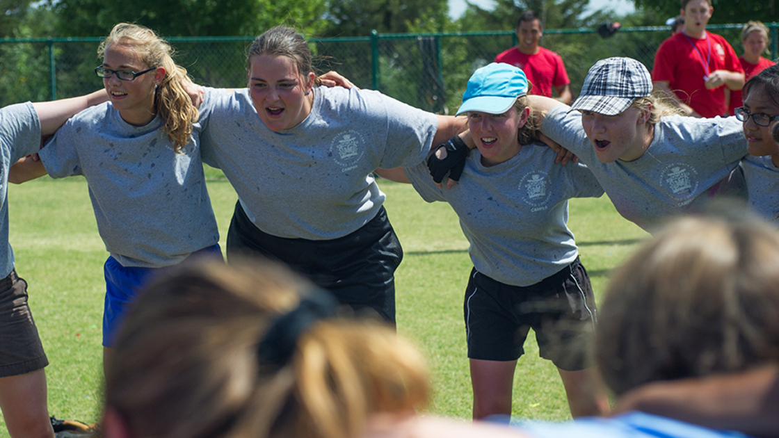 Girls from 5G circle up and cheer as the softball staff decide who to award a ticket. 