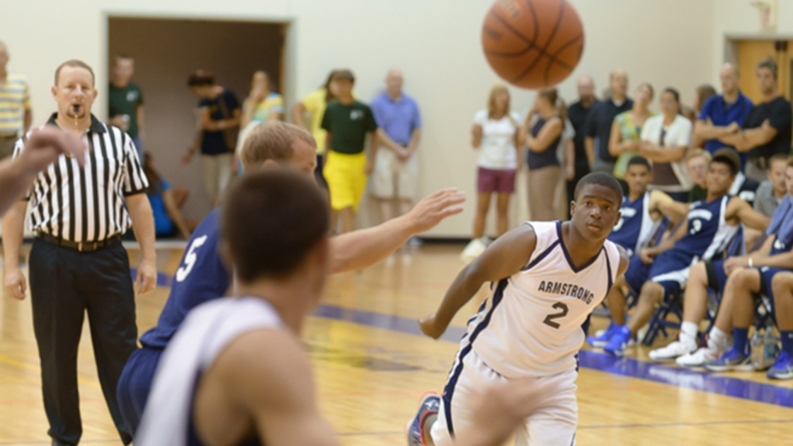 Camper boys (white) make a pass as they go for a shot. 