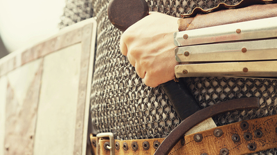 Man Clinching a Sword