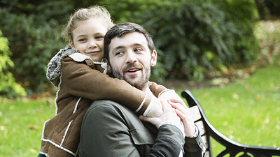 Father and daughter at the park.