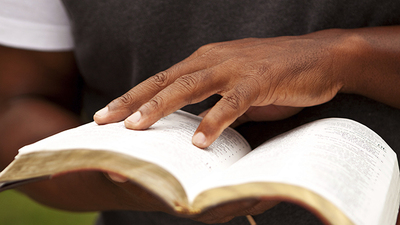 A man reading the Holy Bible. 