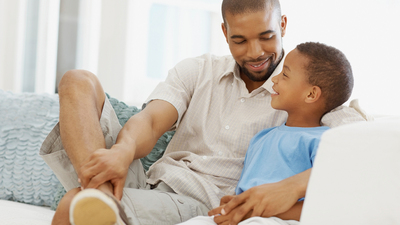 16x9 Atonement
African American father having a casual chat with his son at home