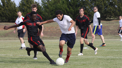 Anthony Chibarirwe and Adiel Granados chase the ball during the Joseph Cup at Herbert W. Armstrong College. 