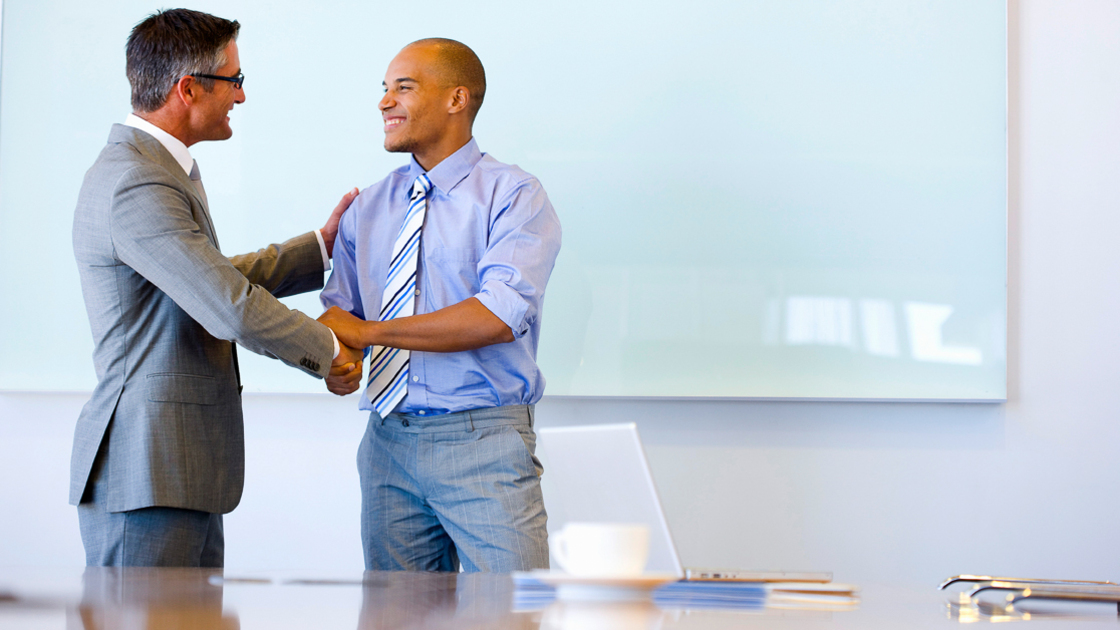 16x9 (The Office)
Two executives shaking hands in a meeting room.