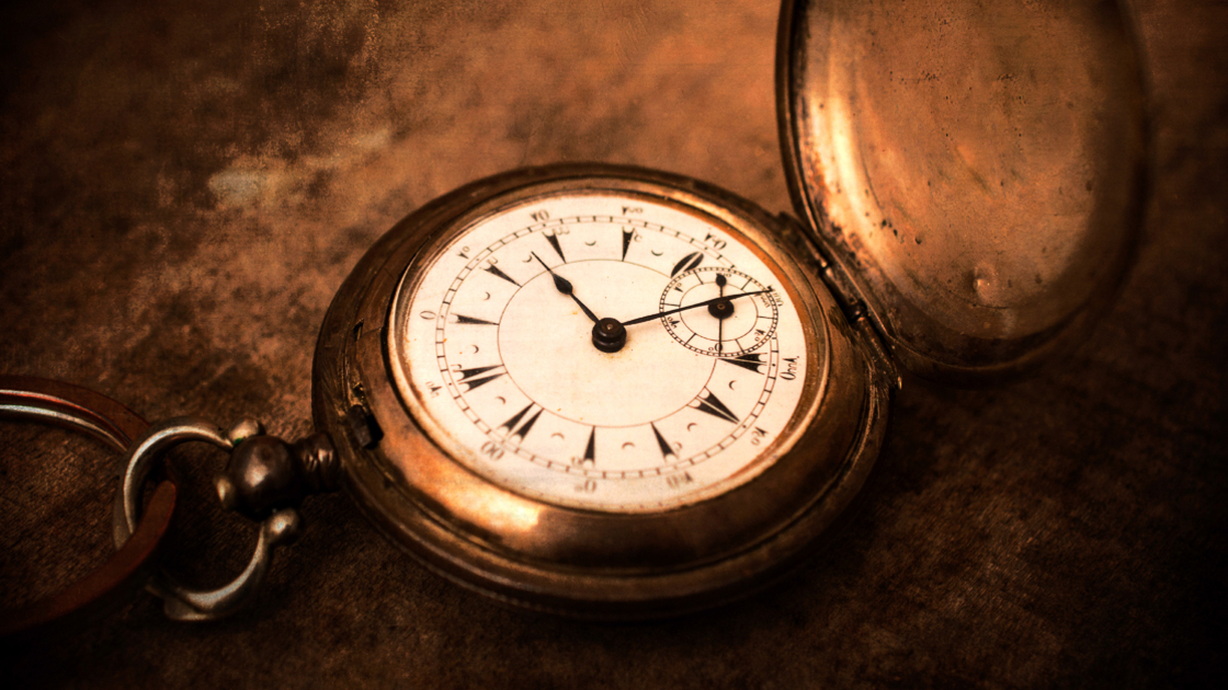 Old vintage pocket watch.Selective focus in the middle of watch