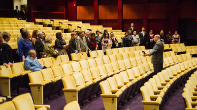 Shane Granger gives tour to Certified Tourism Ambassadors at Armstrong Auditorium.