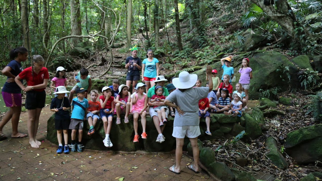 Children gather for instruction on a camp activity. 