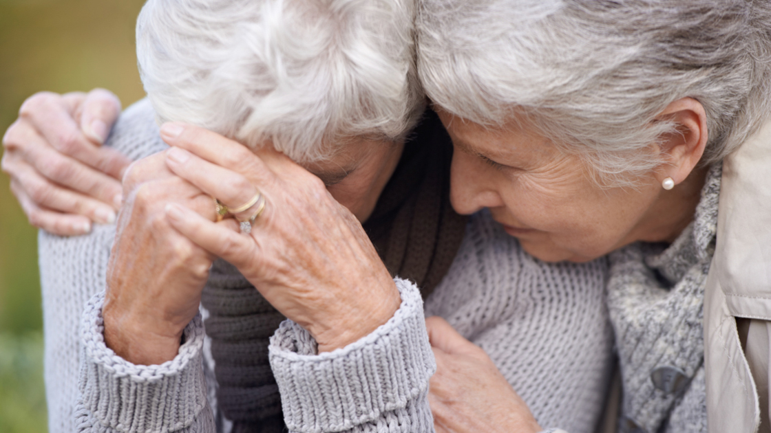 16x9 (Why Suffering?)
A senior woman consoling her friend as they sit outdoors