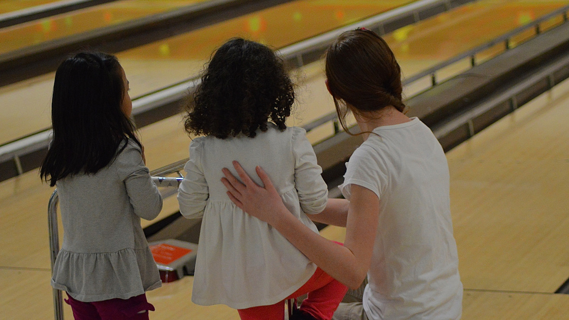 Children bowl with the aid of bumpers.