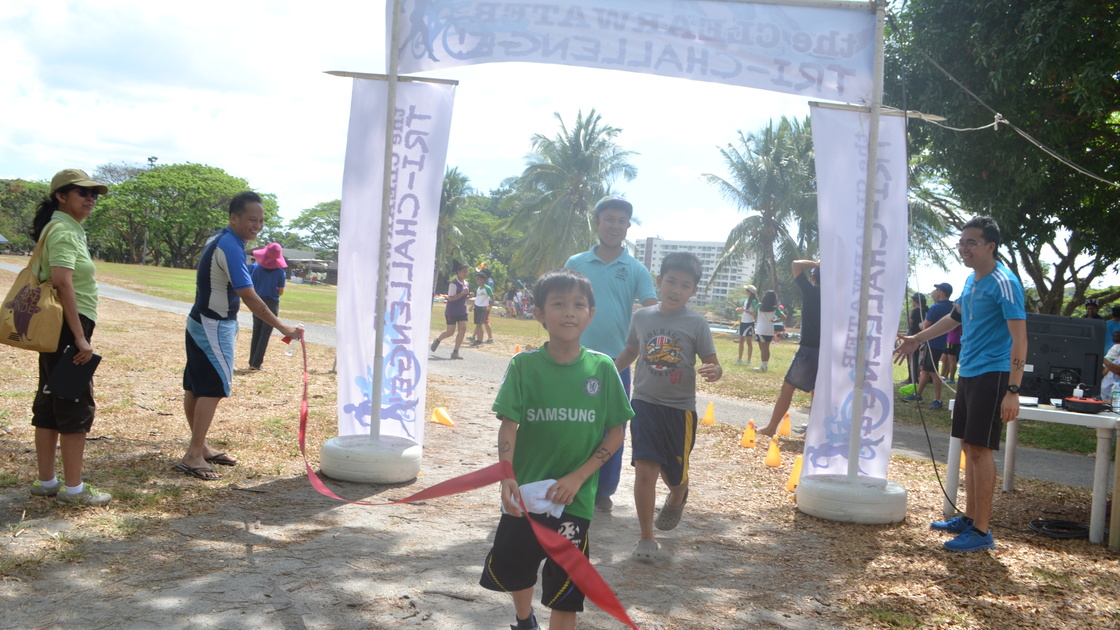 Arthur Machacon with sons Liam and Edmond as they reached the finish line.JPG