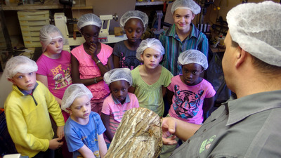 From start to finish: Philadelphia Church of God member Gregory Lightfoot explains the wooden pen-making process. 