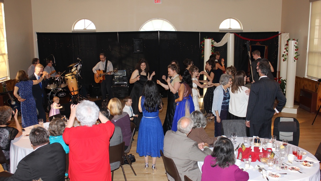 Guests from Milton and London congregations dance to music provided by the live band. 