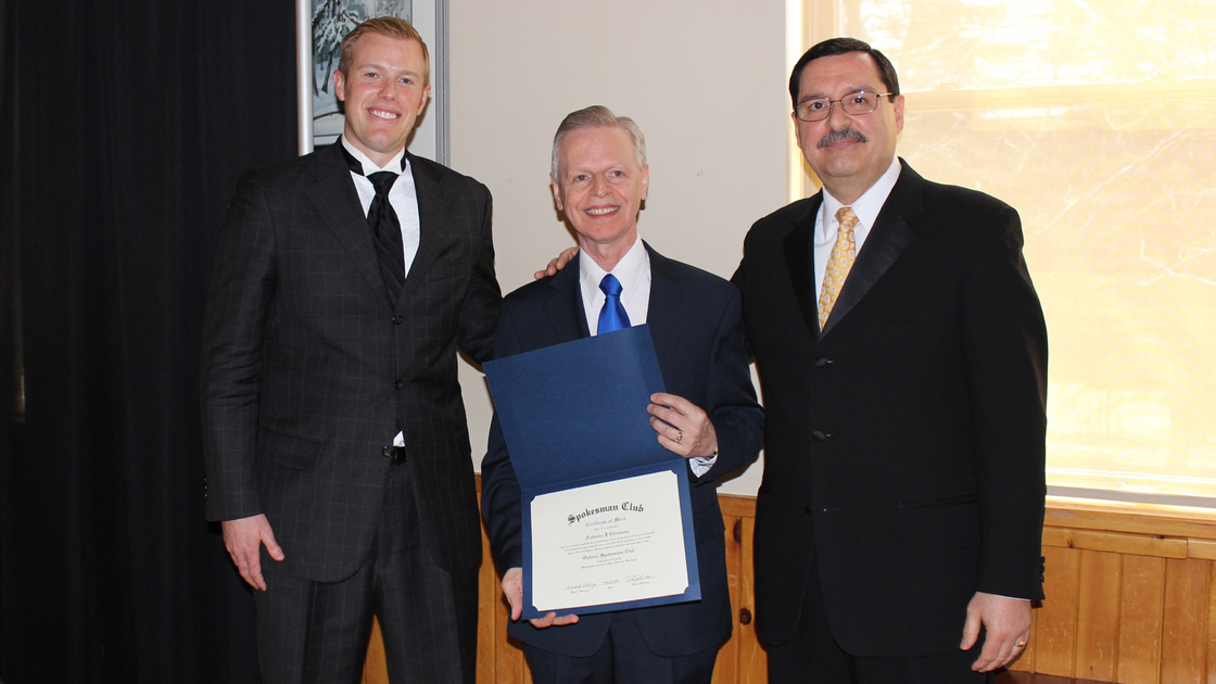 Philadelphia Church of God Local Elder David Weeks (left) and Regonial Director Fred Dattolo (right) congratulate club graduate Antonin Chiasson while he holds his graduation certificate.
