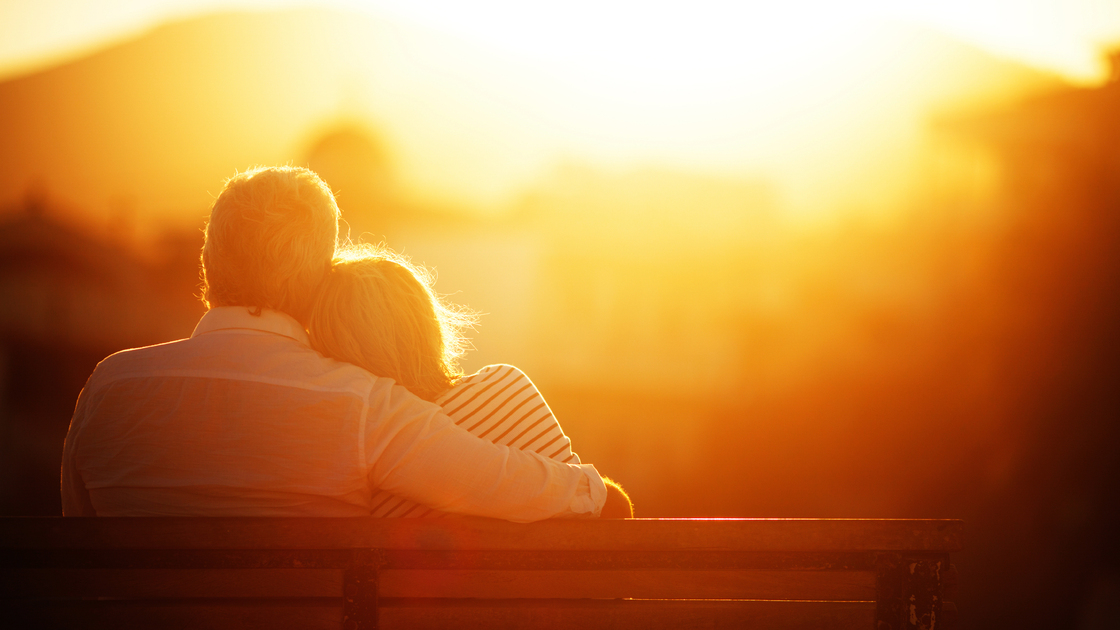 Man and woman watching sunset