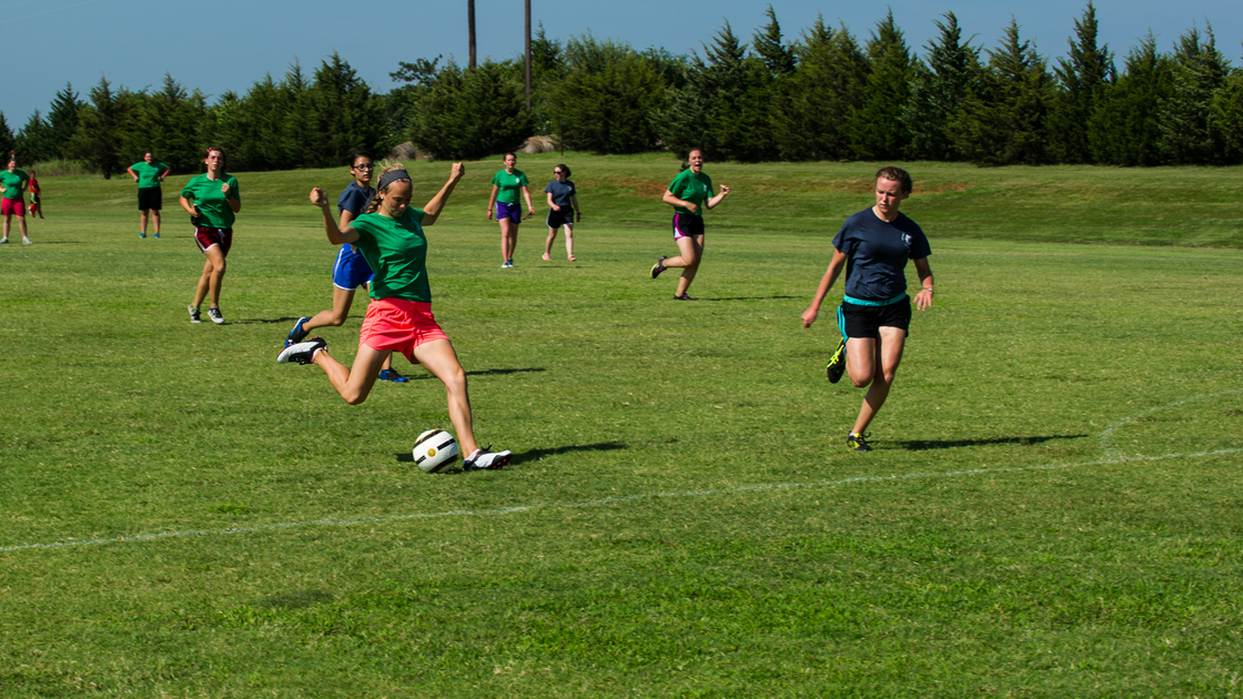 Cami Eagle of 3G kicks the ball to score a game winning goal.