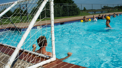 Jordan Saranga shoots against water polo instructor Kaleb Robson