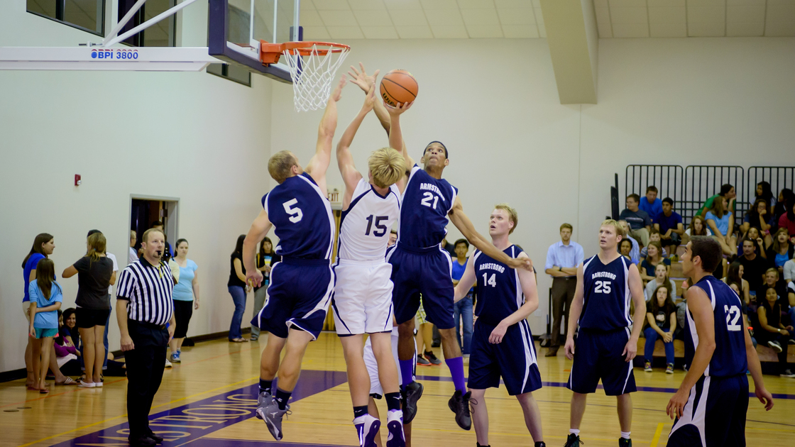 Justin Yocum blocks Tyler Hamby's shot in the men's basketball all star game.