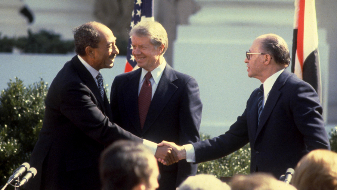 16x9(Peace restored momentarily)
WASHINGTON DC - MARCH 26: This handout file photo provided by the Israeli Government Press Office (GPO) on March 25, 2009, shows Israeli Prime Minister Menahem Begin (R) and Egyptian President Anwar Sadat (L) shaking hands after signing the Israeli-Egyptian peace treaty under the watch of U.S. President Jimmy Carter on the White House lawn on March 26, 1979 in Washington, DC. Israel and Egypt will mark 30 years since their then leaders signed the historic agreement, making Egypt the first Arab nation to recognize the Jewish State.  (Photo by Ya'akov Sa'ar/GPO via Getty Images) *** Local Caption *** Menahem Begin;Anwar Sadat;Jimmy Carter