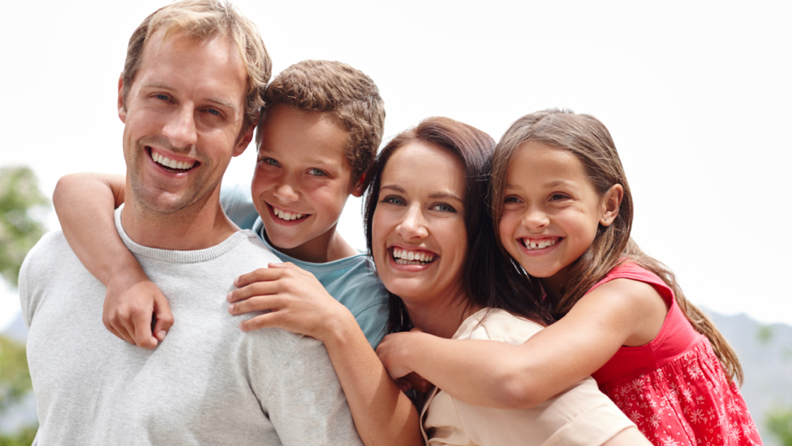 16x9(Spread True Joy)
Portrait of a loving family of four spending time together outdoors