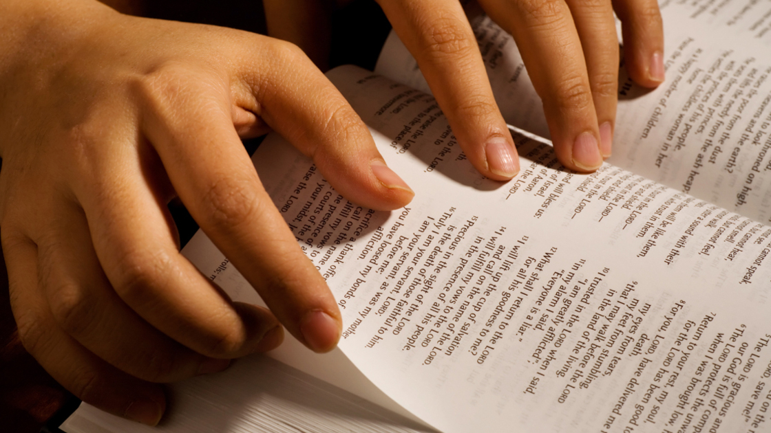 16x9(Use it or lose it!)
A pair of hands scanning and turning the pages of the Bible.