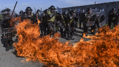 16x9(Are we in the last days)
Riot policemen and soldiers serving in the NATO-led peacekeeping force (KFOR) take part in a crowd and riot control exercise near the village of Vrelo on November 20, 2015. The "Silver Sabre" exercise was conducted by units from KFOR Tactical Reserve Manoeuvre Battalion. AFP PHOTO/ARMEND NIMANI        (Photo credit should read ARMEND NIMANI/AFP/Getty Images)