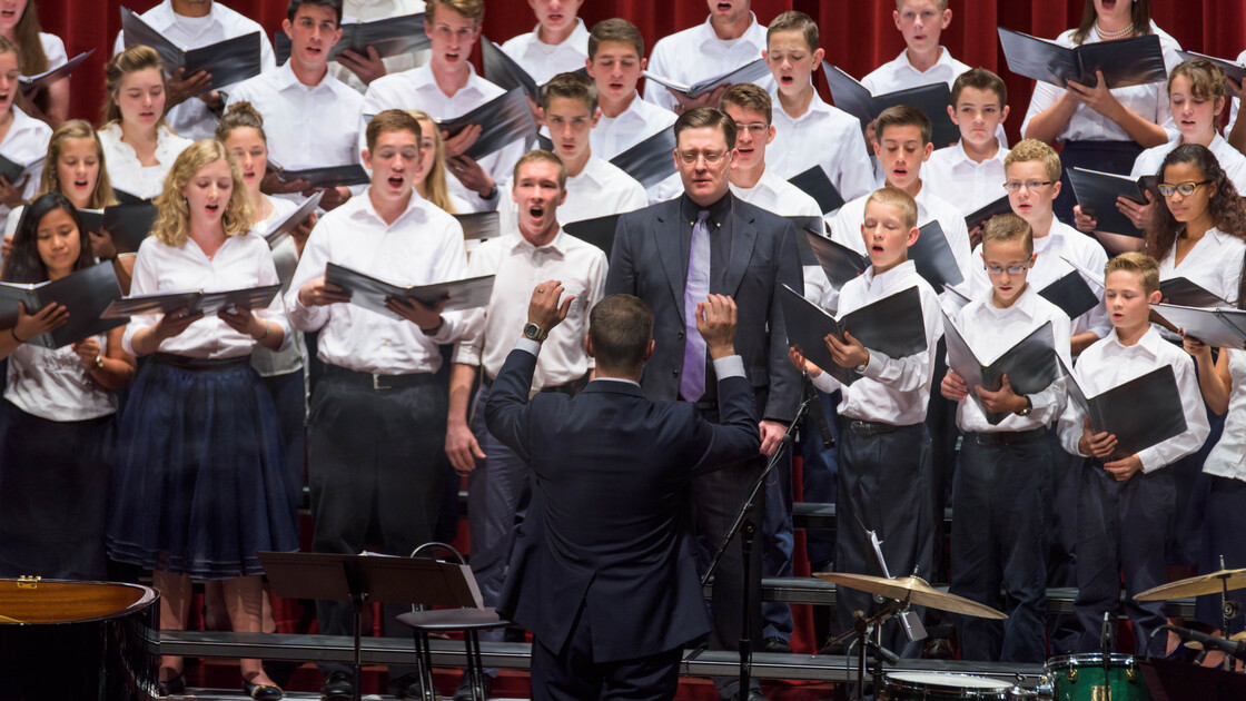 Herbert W. Armstrong and Imperial Academy students sing along together in a performance with Mr. Mark Jenkins at Armstrong Auditorium--conducted by Mr. Ryan Malone.
