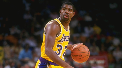 16x9(Magic Johnson met MWA)
1987:  Guard Magic Johnson of the Los Angeles Lakers dribbles the ball during a game at the Great Western Forum in Inglewood, California. Mandatory Credit: Stephen Dunn  /Allsport
