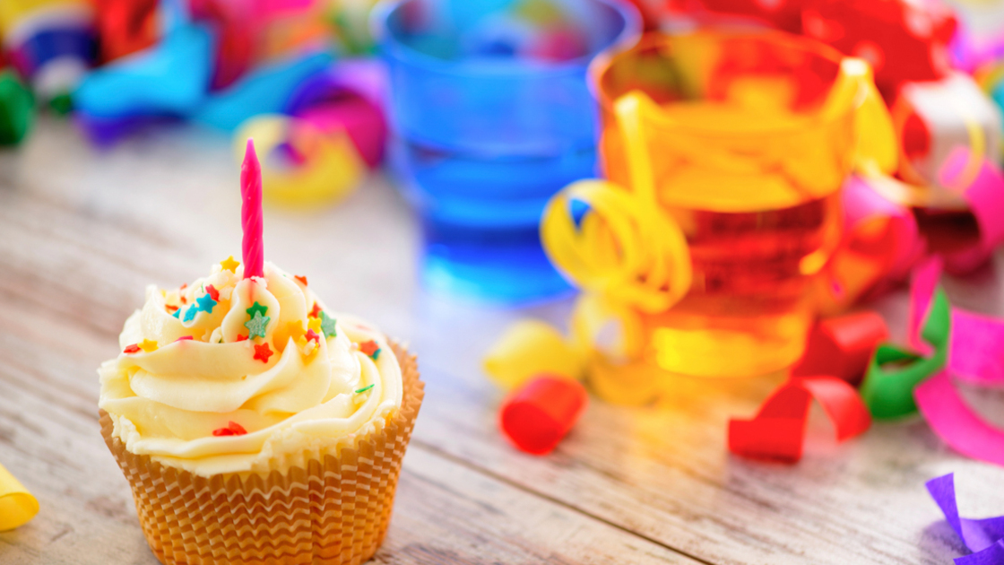 16x9(Happy Birthday?)
Celebrating a special day. Side view image of a cupcake with multicolored confetti as a frame and bright glasses on the background