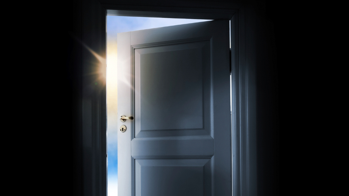 16x9(Characteristics of a savior)
Opening blue door in a dark room with shining light and sky outside