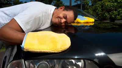 16x9(The sin of idolatry)
Man carefully polishing his car with polishing gloves