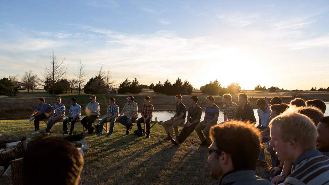 AC002.jpg Male students of Herbert W. Armstrong College enjoy a night of fun an entertainment on the island of a lake on the school's campus in Edmond, OK.