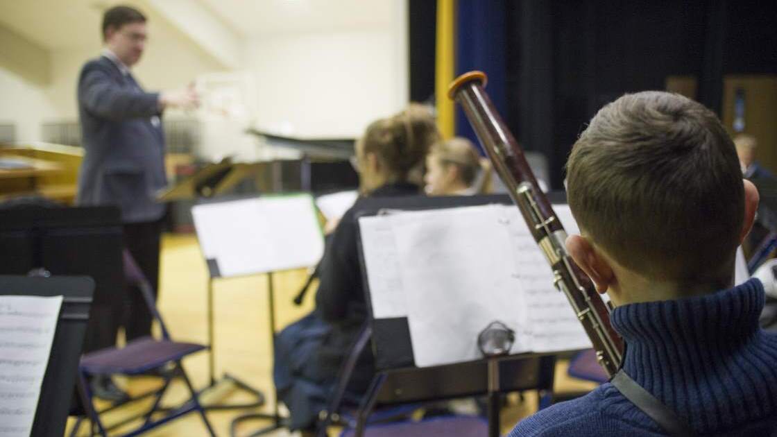 IA001.jpg Students of Imperial Academy rehearse their latest piece during an orchestra class