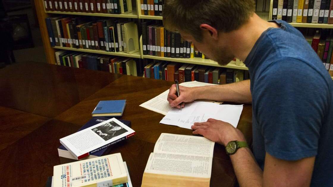 AC020.jpg Reese Zoellner, a student at Herbert W. Armstrong College (2015) utilizes the school's library as a quiet place to study.