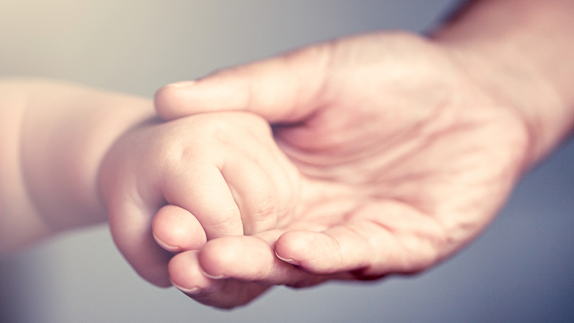 16x9(Spiritual maturity)
little baby hand holding his mother finger in vintage color filter, selective focus