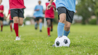 Kids playing soccer. 